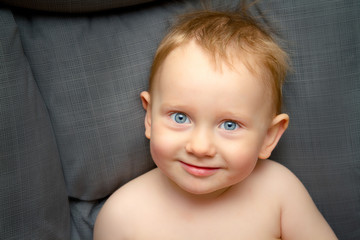 blue-eyed boy with red hair looking at the camera