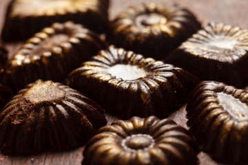 chocolate sweets with edible golden powdeer