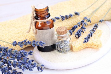 Lavender essential oil. Aroma oil bottles, dried lavender flowers. Herbal skincare.