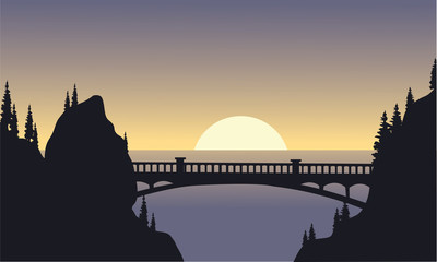 Silhouette of bridge and moon