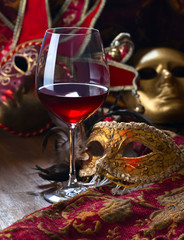 Venetian masks and red wine