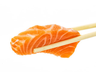 Salmon sushi with chopsticks shot on white