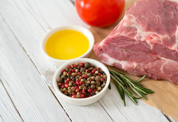 raw pork neck meat on wooden table