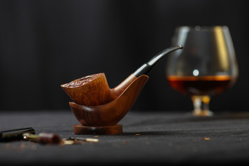Smoking pipe on the table