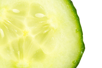 Close up slice of fresh cucumber on white