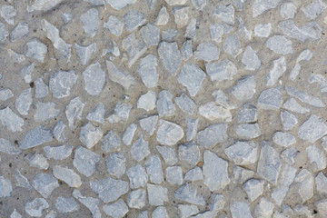 Gray stones in concrete. Texture.