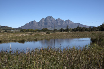 Simonsberg Mountain close to Stellenbosch in the Western cape South Africa viewed across a farm dam