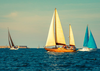 Fototapeta premium Yachts sailing of the sea. Nautical landscape with sailboats - cruising yacht in regatta race.