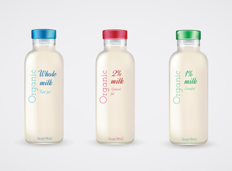 Set of glass bottles with milk. Reduced fat milk. Organic milk.