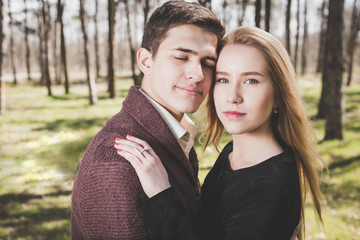 Stunning sensual outdoor portrait of young stylish fashion couple