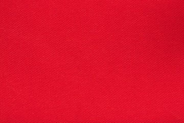 Red cotton surface. Closeup