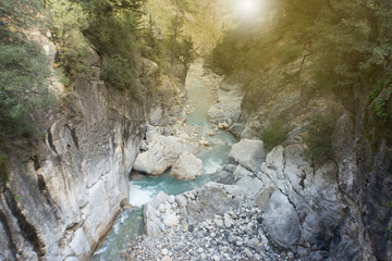 Mountain river flowing through a canyon in the summer.