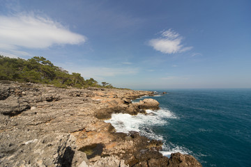 Beautiful sea paradise beach on a background of blue sky with clouds. 