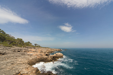 Beautiful sea paradise beach on a background of blue sky with clouds. 