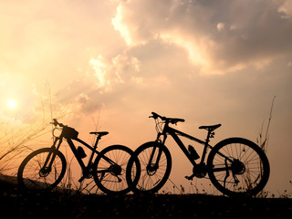 Fototapeta na wymiar Silhouette of two bicycle at sunset