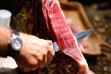 Abwaschbare Fototapete Sliced ham during a festival © Uncleraf