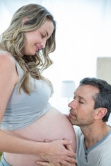 Man holding pregnant womans stomach