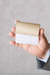 A man and a finished toilet paper roll