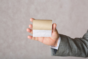 A man and a finished toilet paper roll
