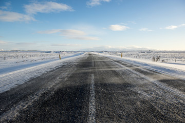 Winter asphalt road with snow, Iceland
