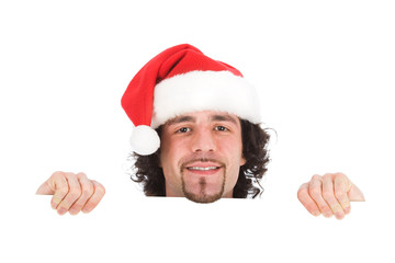 young businessman with santa hat isolated on white behind someth