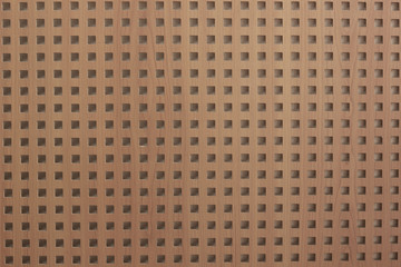 Fototapeta premium Texture brown perforated surface
