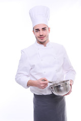 young cook chef isolated on white background with a bowl and whip preparing food