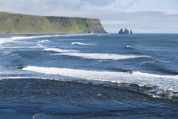 Fototapeta na wymiar Atlantic coast landscape from Dyrholaey view point, waves and Reynisdrangar rocks, South Iceland