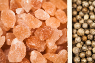 Spices and black rice in a wooden box: red, green and white pepper, sea salt, himalayan salt, allspice and coriander