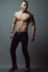 Fototapeta na wymiar Bodybuilding, body sculpture concept. Male model with perfect body