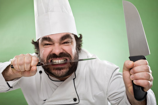 smile chef cooking with knife isolated on green