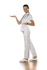 a young woman doctor holding an imaginary object