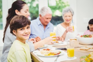 Portrait of smiling boy with family 