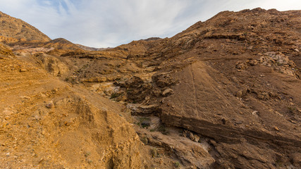 Narrow canyon with vertical walls on both sides. Rocky landscape background. Mosaic Canyon, Death Valley National Park, California
