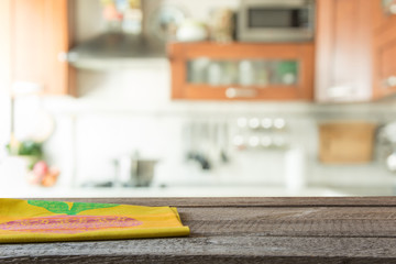 Blurred background. Modern kitchen with tabletop and space for you.