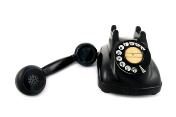 old telephone with rotary dial isolated on white background