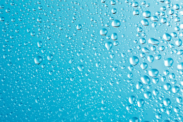 condensation drops on glass with blue backgroung