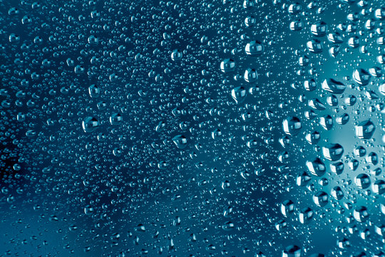 Condensation Drops On Glass With Blue Backgroung