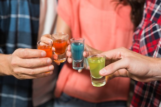 Friends Toasting With Shots