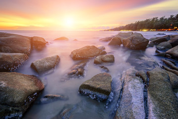 Seascape Thailand, the waves ripple rock and sunrise at the beach beautiful landscape.