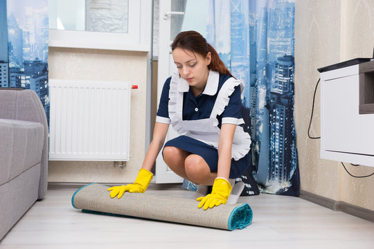 Young woman doing the housekeeping