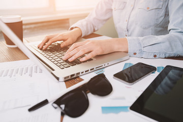 Business woman working at the office. She uses generic design la