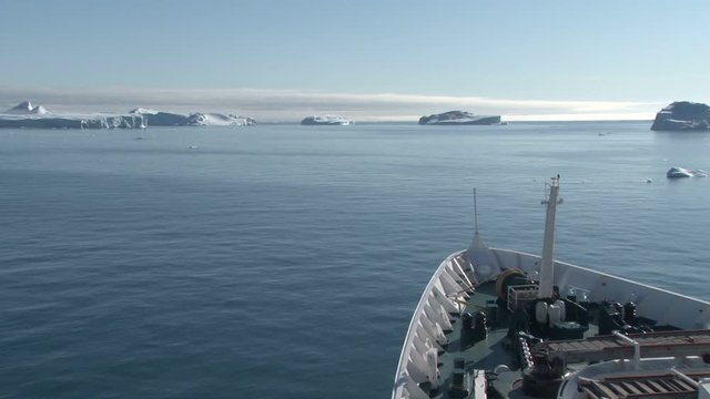 View of the icebergs of Disko Bay, Ilulissat, Greenland from the bow of a ship