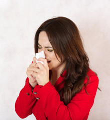 Acrying young woman dressed in a formal way.