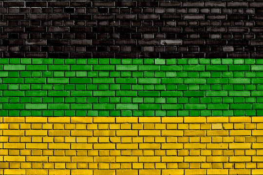 Flag Of African National Congress Painted On Brick Wall