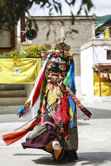 An unidentified buddhist lamas dressed in mystical mask dancing Tsam mystery dance in time of Yuru Kabgyat Buddhist festival at Lamayuru Gompa