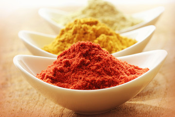 Various spices on wooden background