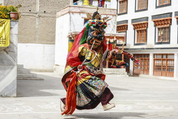 An unidentified buddhist lamas dressed in mystical mask dancing Tsam mystery dance in time of Yuru Kabgyat Buddhist festival at Lamayuru Gompa, Ladakh, North India