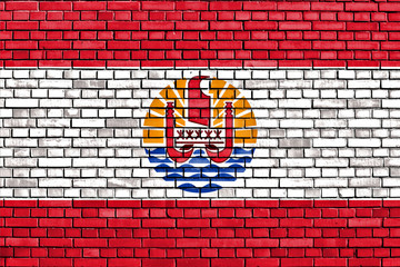 flag of French Polynesia painted on brick wall