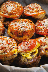 Braised pork with tomatoes and onion in a frying pan